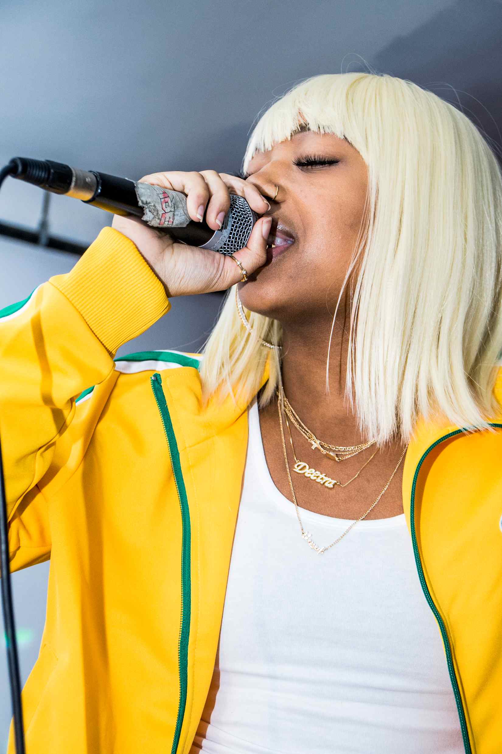 Deetranada performs Flat Out with blonde hair